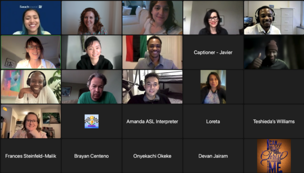 Still frame from a Zoom meeting showing a lot of smiling faces